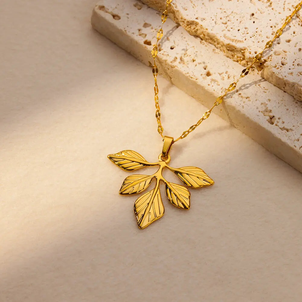 Verdant Muse – Golden Leaf Pendant