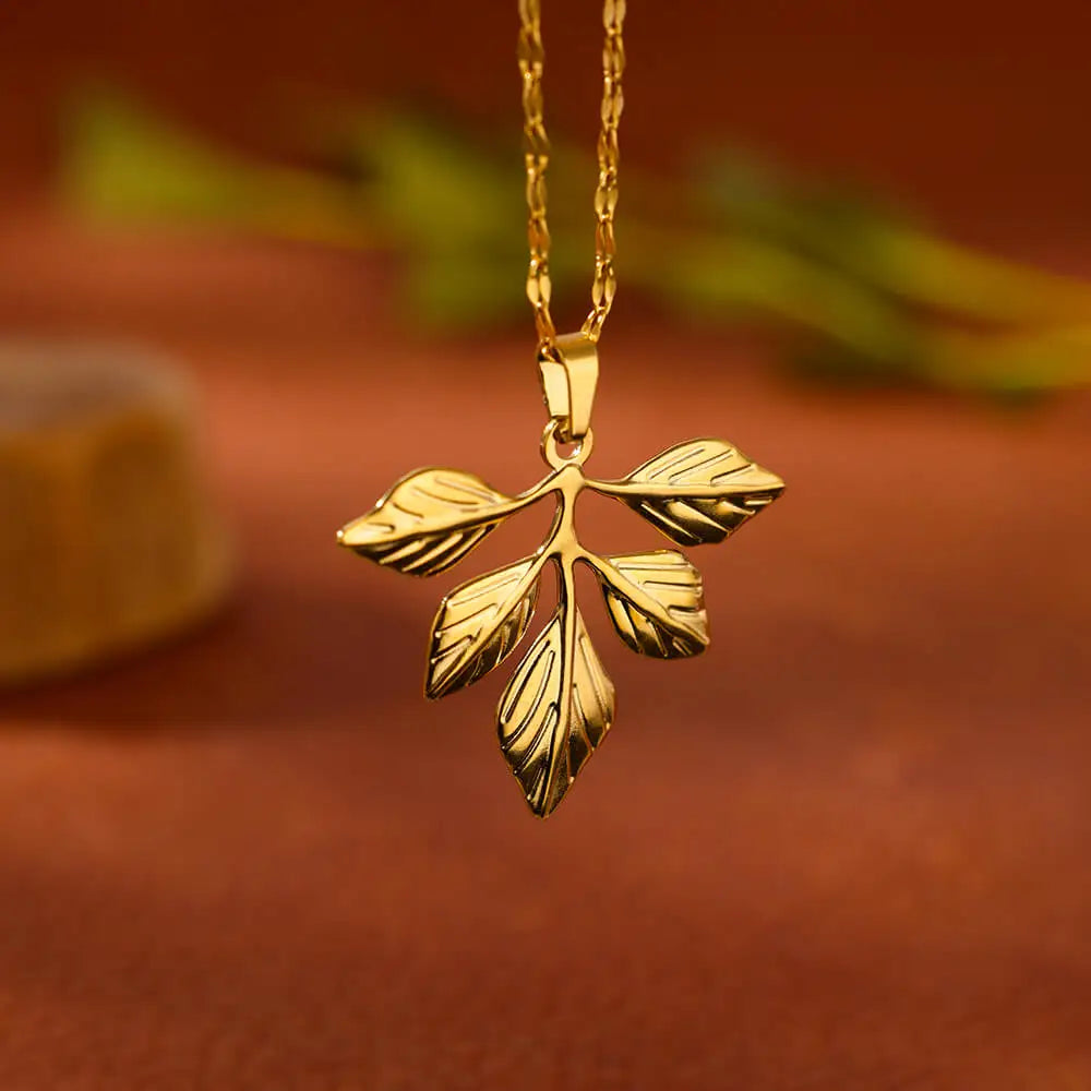 Verdant Muse – Golden Leaf Pendant